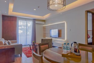 2 Bedroom Suite | Living area | Flat-screen TV
