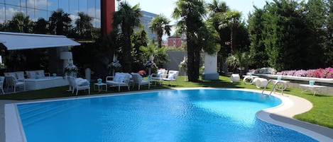 Seasonal outdoor pool, open 11:00 AM to 6:00 PM, sun loungers