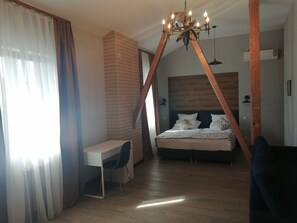 Suite estudio Deluxe, vista a la montaña | Ropa de cama de alta calidad y minibar