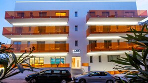 A modern building with a 'Smart' sign, featuring multiple balconies and a visible entrance. - Mix Smart (Llucmajor)