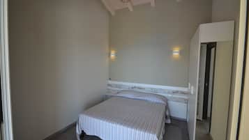 Apartamento, 2 quartos (6 Prs) | 2 quartos, escrivaninha, Wi-Fi de cortesia, roupa de cama