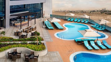 2 outdoor pools, open 7:30 AM to 8:00 PM, pool umbrellas, pool loungers