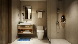 A modern bathroom with a toilet, sink, mirror, and shower. - Aspira One Sutthisan (Bangkok)