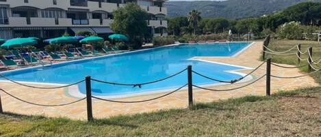 Outdoor pool, pool umbrellas, pool loungers