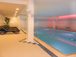 An indoor swimming pool with tiled walls and a checkered floor pattern. - Seestern Whg. 4/50, Germany (Ostseebad Boltenhagen)