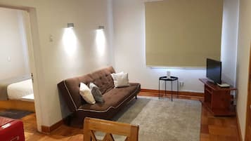 Superior Apartment | Living area | 32-inch flat-screen TV with cable channels