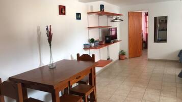 Standard Apartment | Living area | 32-inch flat-screen TV with cable channels, TV