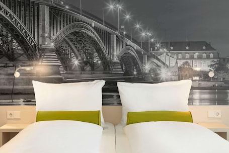 In-room safe, desk, laptop workspace, blackout curtains. Super 8 by Wyndham Mainz Zollhafen