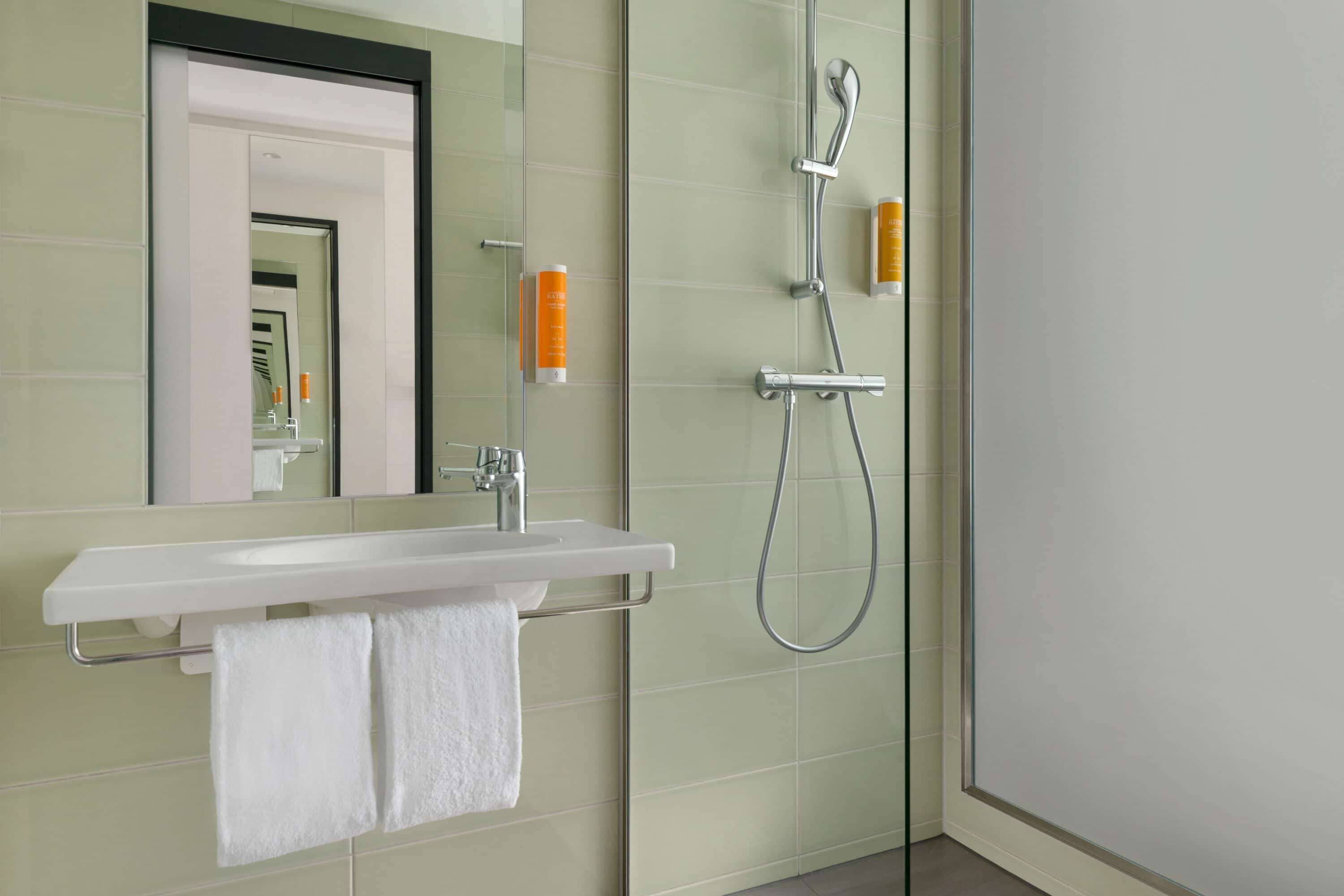 shower, hair dryer, heated floors, towels