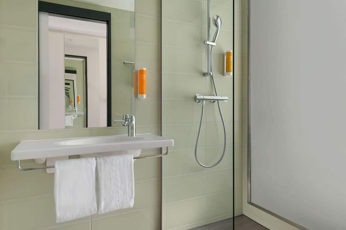 shower, hair dryer, heated floors, towels