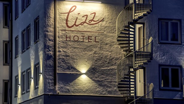 A building facade with a sign that reads "Liz Hotel" in a stylized font. - Lizz Hotel Munich (Munich)