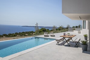 2 outdoor pools, a heated pool, pool umbrellas, sun loungers - Oikos Boutique Residences (Kefalonia)