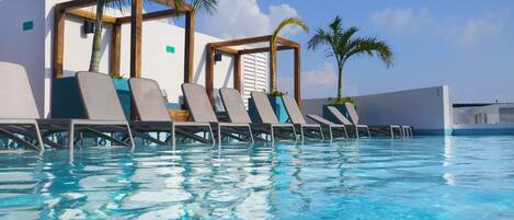 2 outdoor pools, an infinity pool, pool umbrellas, pool loungers