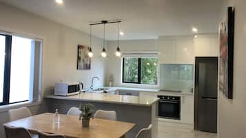 Two Bedrooms Unit | Living area | 14-inch flat-screen TV with satellite channels, Smart TV