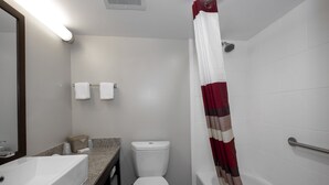 A bathroom with a white sink, toilet, and bathtub. - Red Roof Inn PLUS+ Tuscaloosa - University (Tuscaloosa)