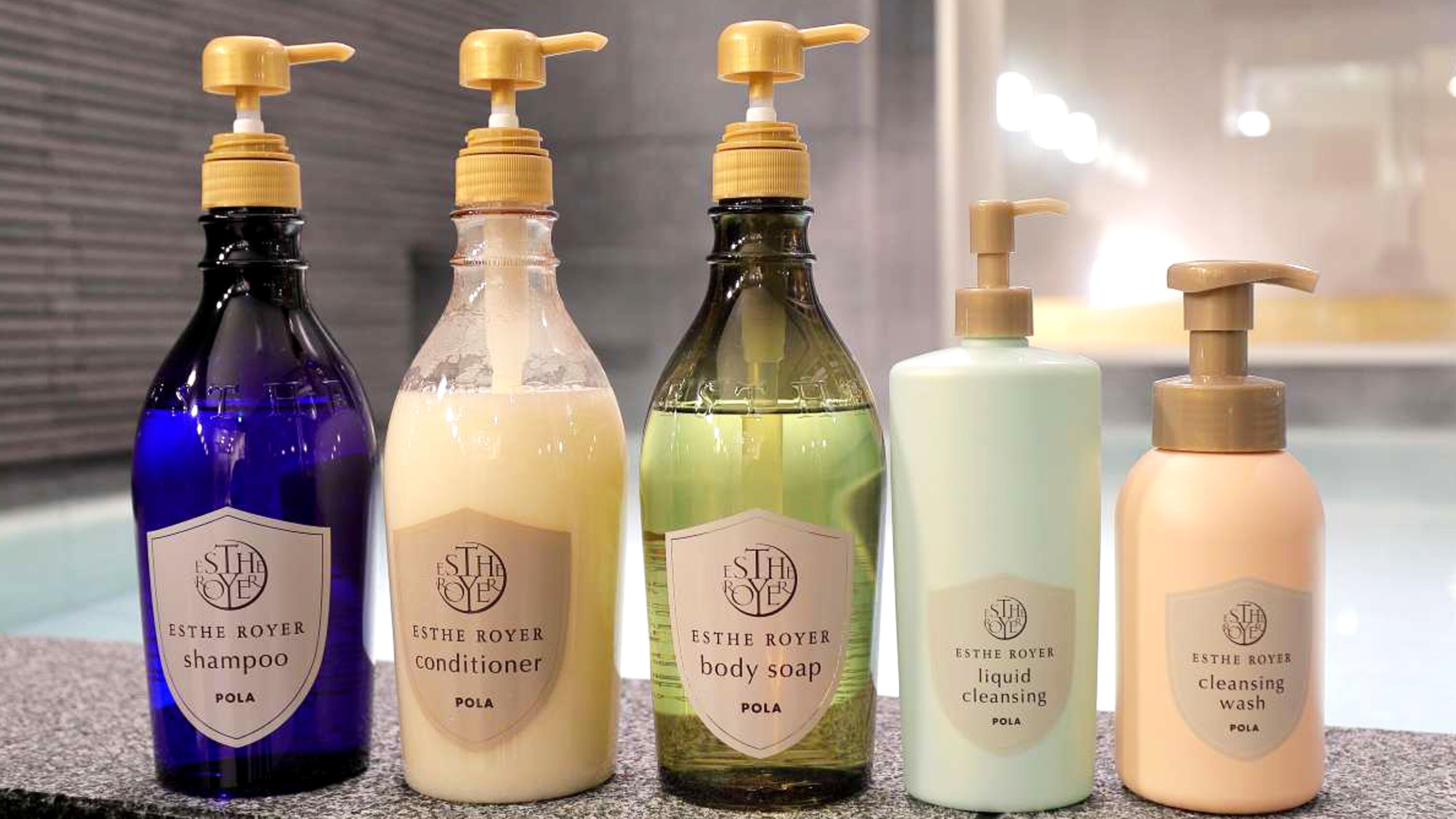 Five bottles of ESTHE ROYER products: shampoo, conditioner, body soap, liquid cleansing, and cleansing wash.