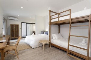 Quad Room | In-room safe, desk, laptop workspace, blackout drapes