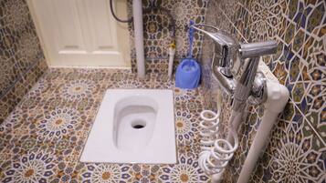 Shower, free toiletries, hair dryer, slippers