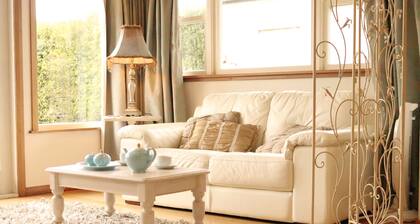 A French style boutique guesthouse set in a large garden with a spa and pool.