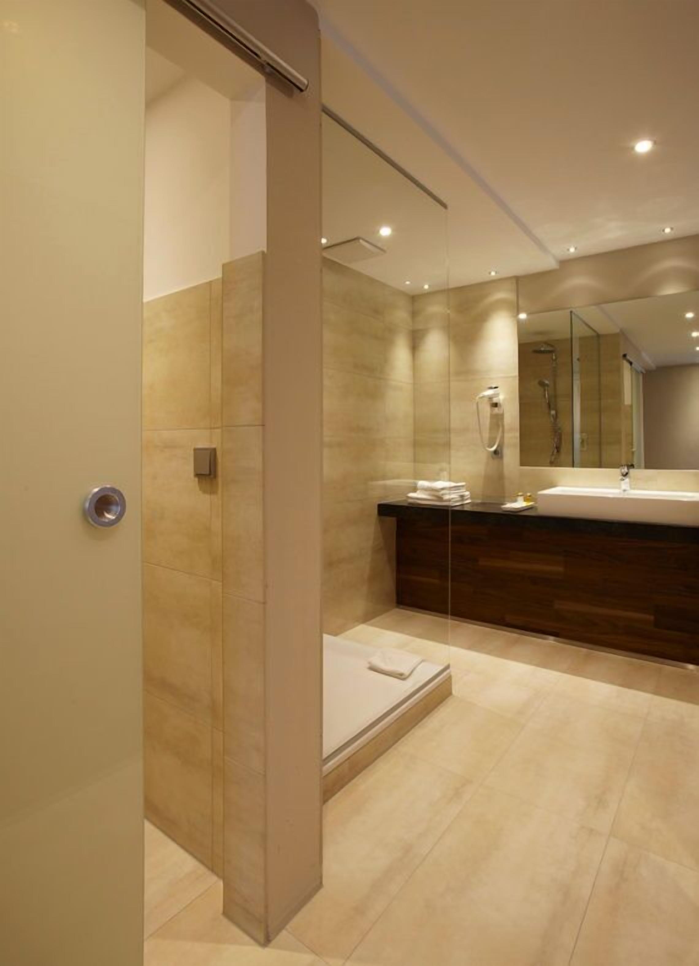 shower, bathrobes, slippers, towels