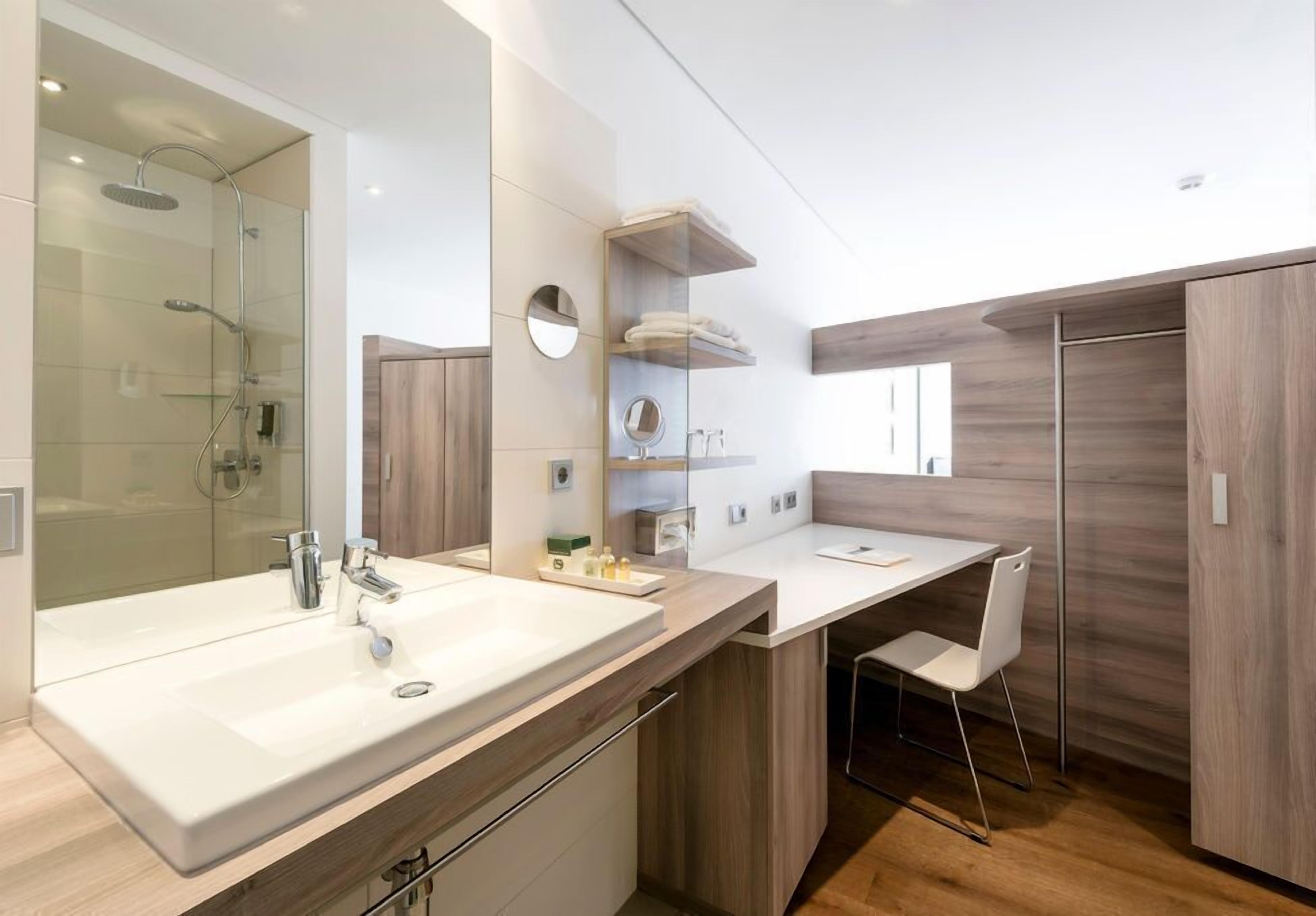 shower, bathrobes, slippers, towels