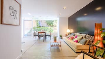 Deluxe Apartment | Living area | 120-cm flat-screen TV with digital channels, TV