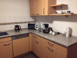 Fridge, stovetop, dishwasher, cookware/dishes/utensils