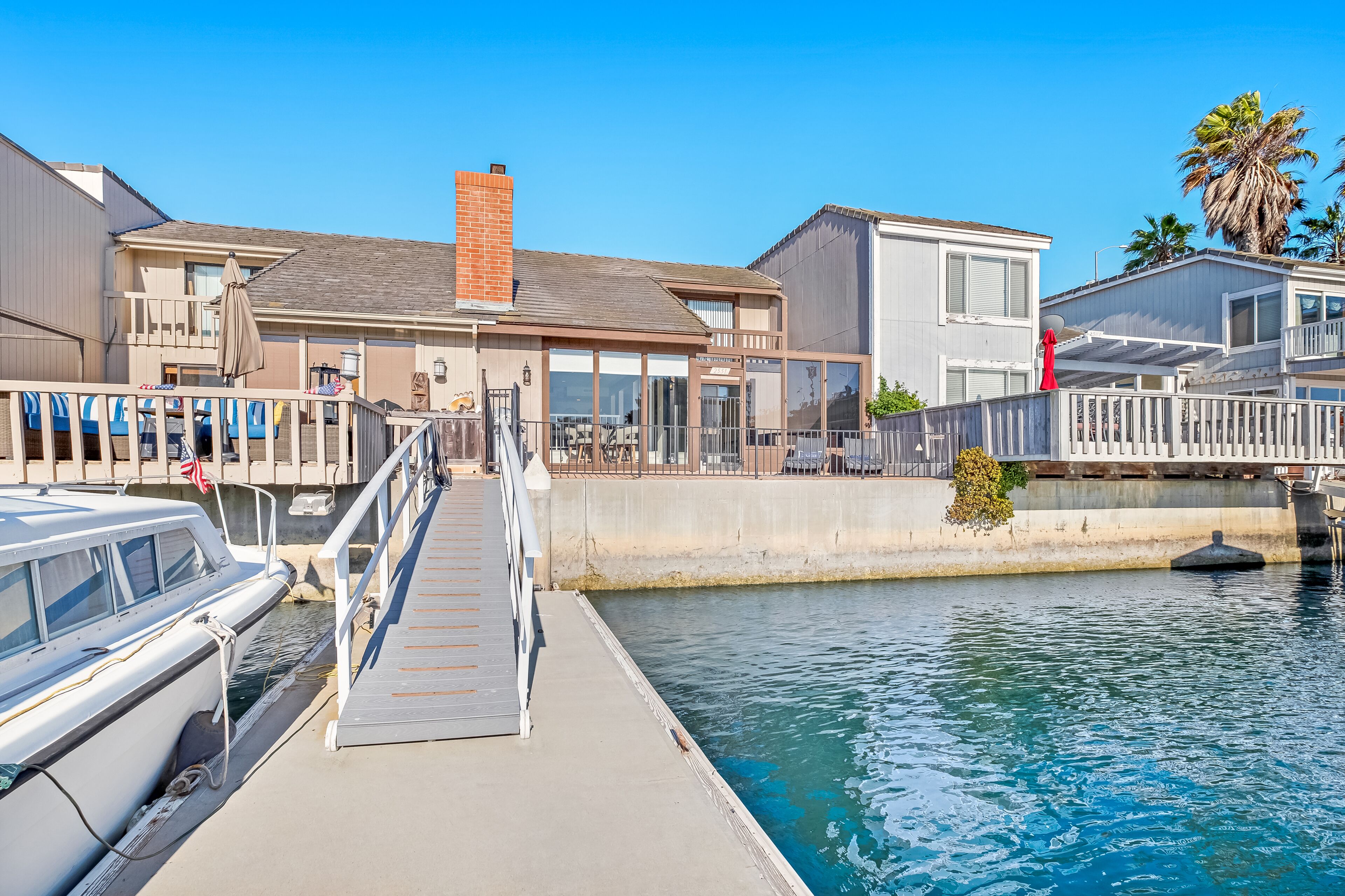 Unique & sleek dog-friendly two-level home w/water views, pool table & dock