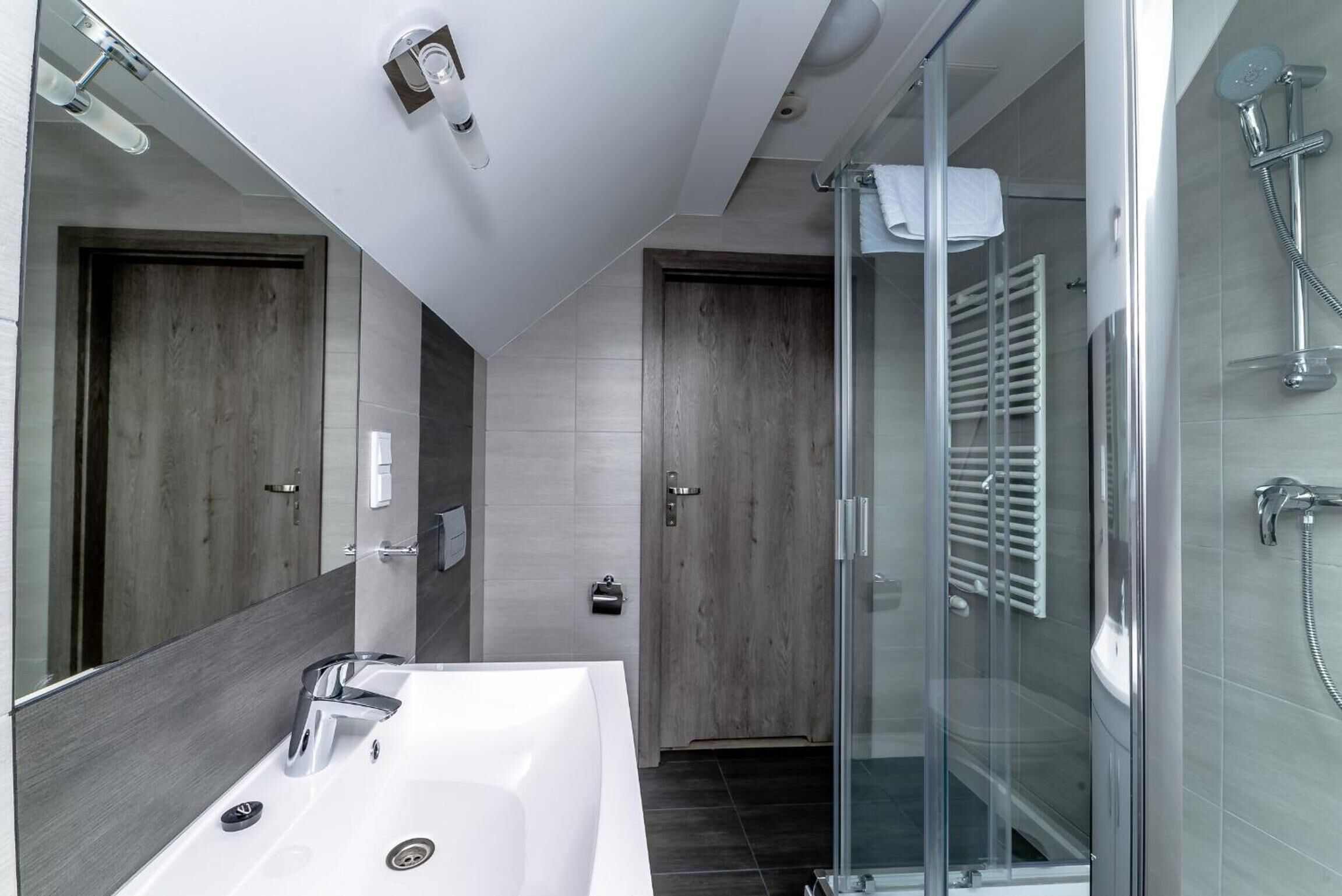 Shower, designer toiletries, towels