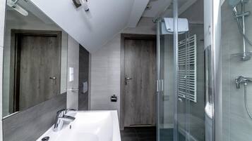 Shower, designer toiletries, towels