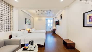 City Quadruple Room | Minibar, in-room safe, blackout curtains, iron/ironing board