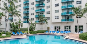 Outdoor pool, pool umbrellas, sun loungers