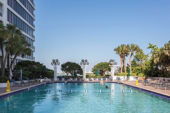 Outdoor pool, a heated pool, open 6:00 AM to 10:00 PM, pool umbrellas
