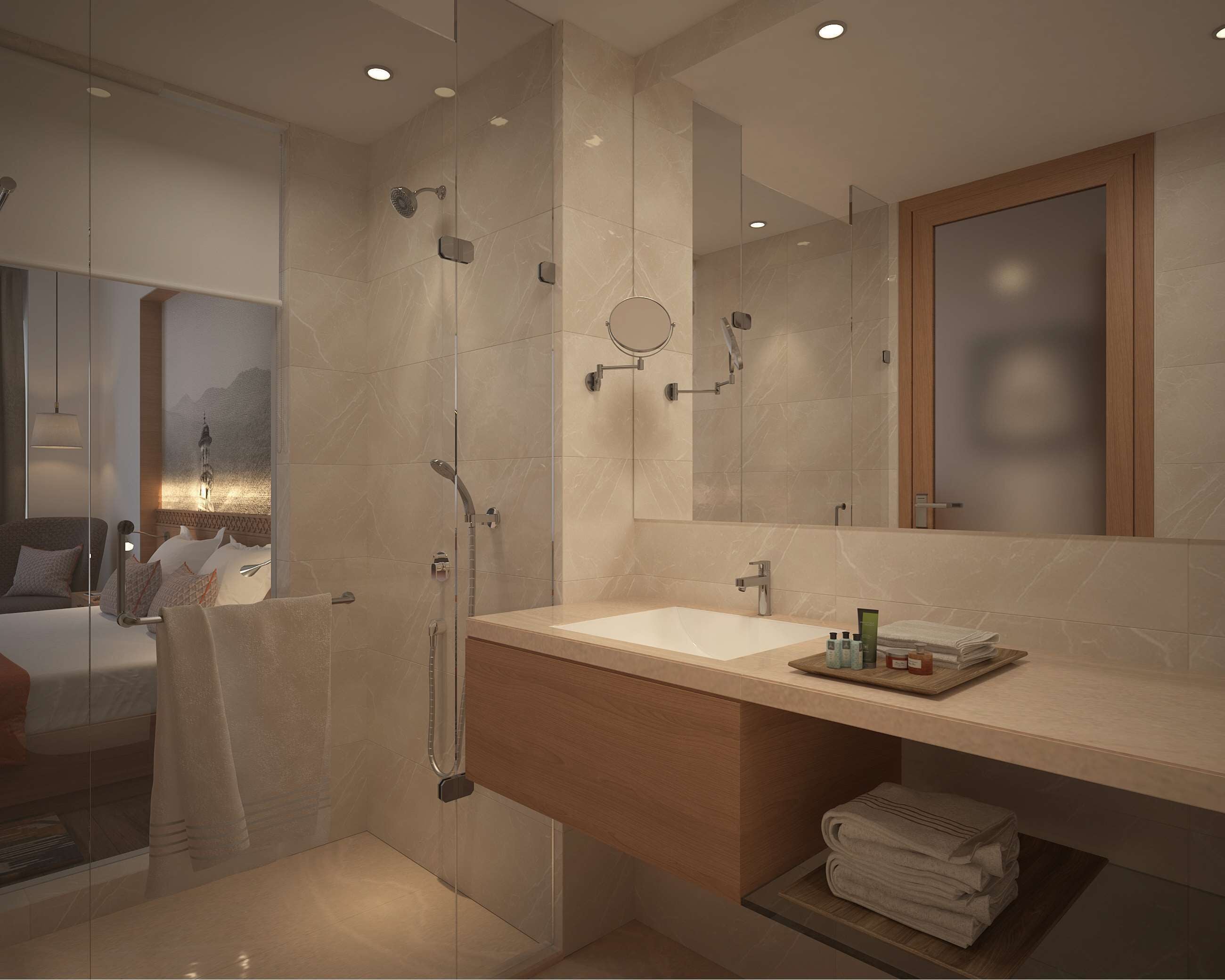Un baño moderno con ducha envuelta en vidrio, tocador de madera y un espejo grande.