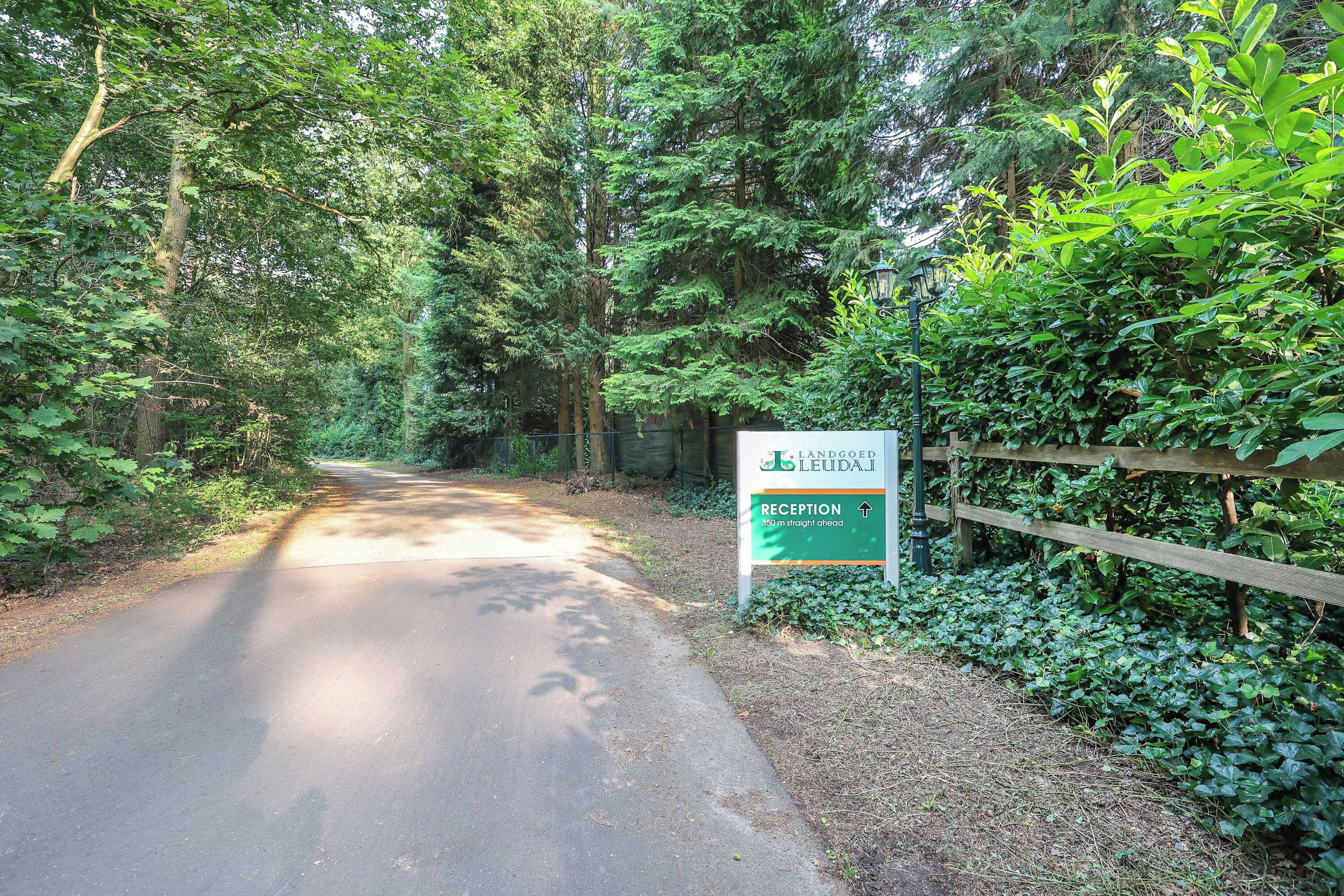 A reception sign for Landed Leudai, indicating a reception area 50 meters straight ahead.