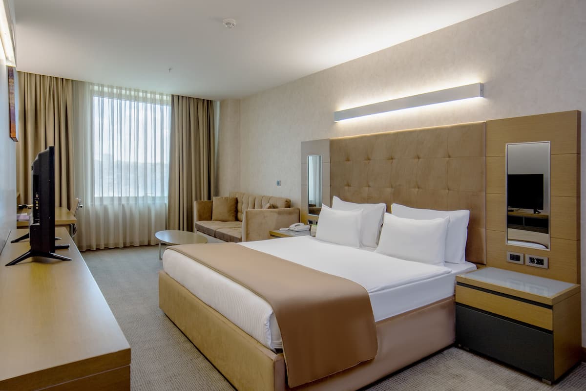 Suite ejecutiva, 1 cama King size | 1 habitación, minibar y caja de seguridad en la habitación