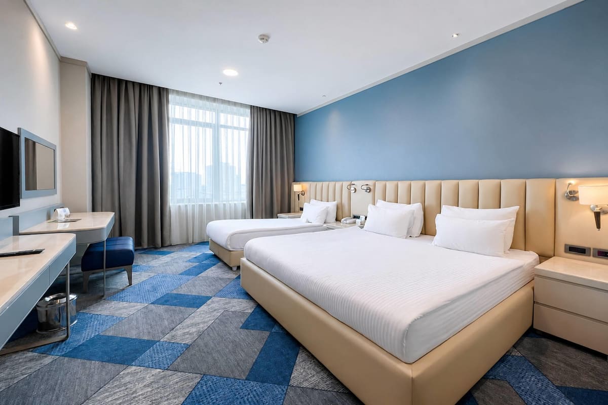 Superior Room, Multiple Beds | Minibar, in-room safe, desk, laptop workspace
