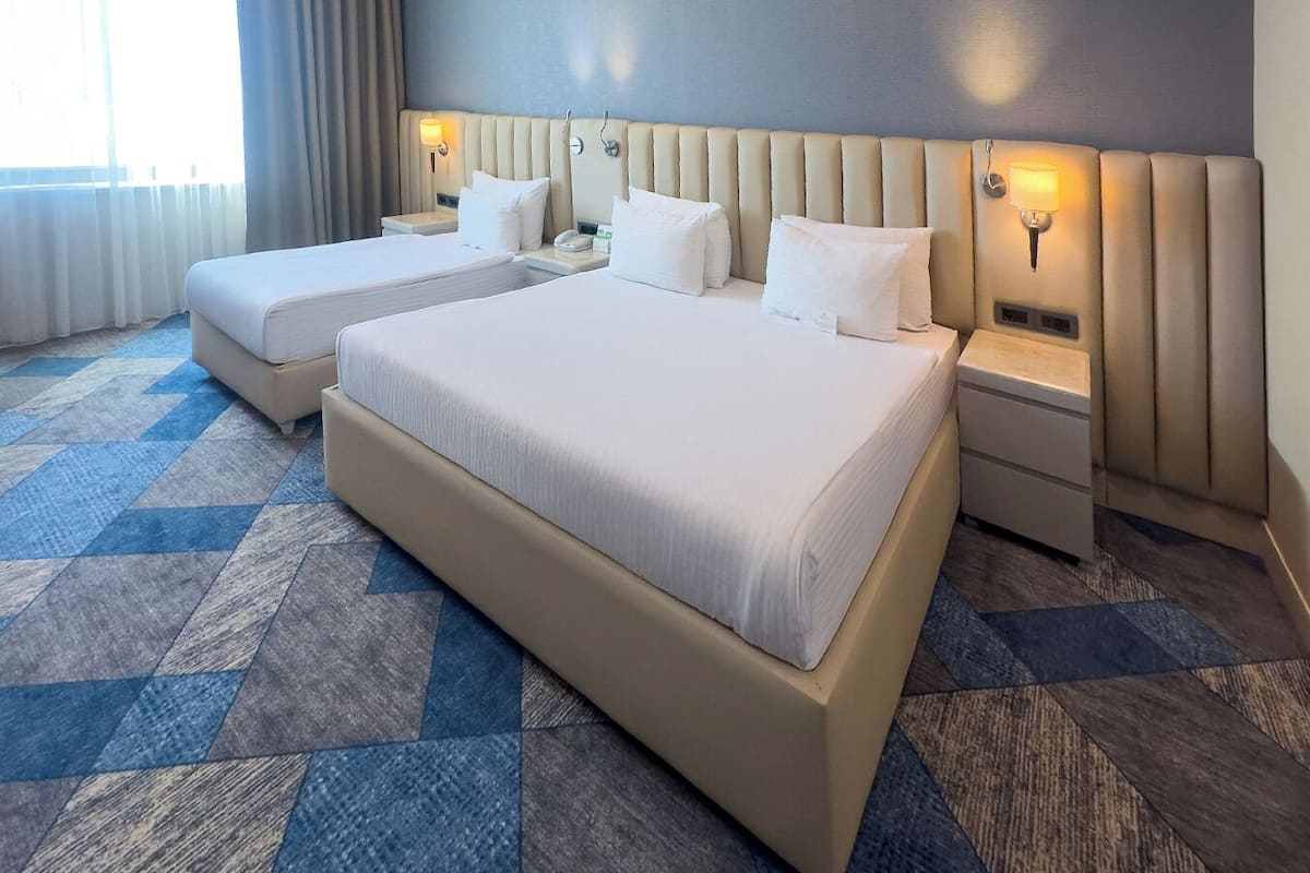 Superior Room, Multiple Beds | Minibar, in-room safe, individually decorated, individually furnished
