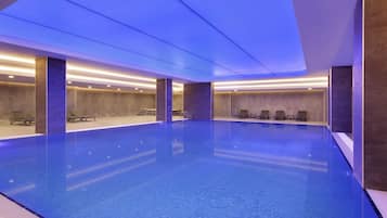 Indoor pool, open 10:00 AM to 10:00 PM, pool loungers