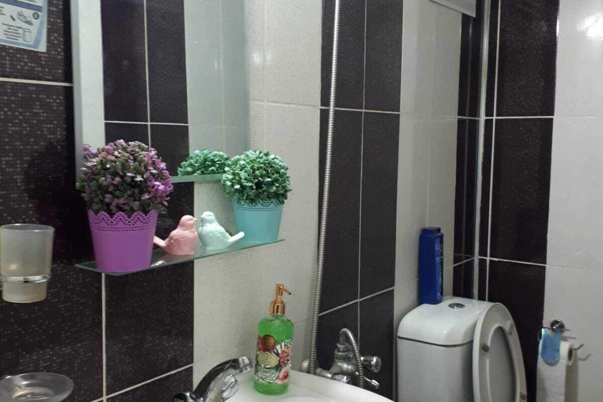 private family room | bathroom | shower, hair dryer, slippers, towels