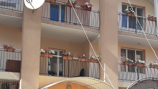 A multi-story hotel with balconies, a sign reading "FOTECAB", and a brick entrance. - Galant Hotel (Boryspil)