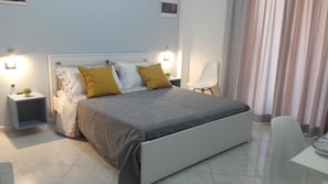 Desk, laptop workspace, iron/ironing board, rollaway beds