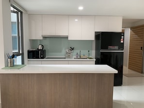 Fridge, microwave, stovetop, cookware/dishes/utensils