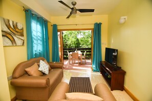 Premier Apartment, 1 Bedroom, Partial Ocean View, Garden Area | Living area | 43-inch Smart TV with digital channels, TV, Netflix - Spice Bay Suites (Micoud)