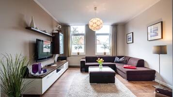 Apartemen, 2 kamar tidur | Area keluarga | TV layar datar, perapian, dan pemutar DVD