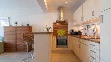 Apartment, 2 Bedrooms | Private kitchen | Full-sized fridge, microwave, oven, stovetop