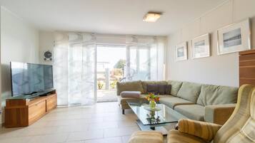 Apartment, 2 Bedrooms | Living area | Flat-screen TV, DVD player