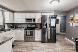 Fridge, microwave, oven, stovetop - Spacious & Updated! Marquette Township Home - HotTub - Backyard - Garage (Marquette)