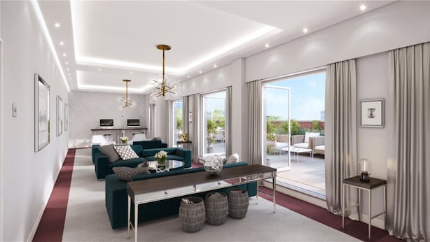 A modern living room with a sofa, coffee table, and a dining area. There is a balcony with outdoor seating. - Designer City Centre Apartment (Coventry)