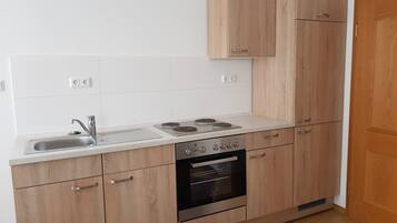 Fridge, stovetop, coffee/tea maker, cookware/dishes/utensils